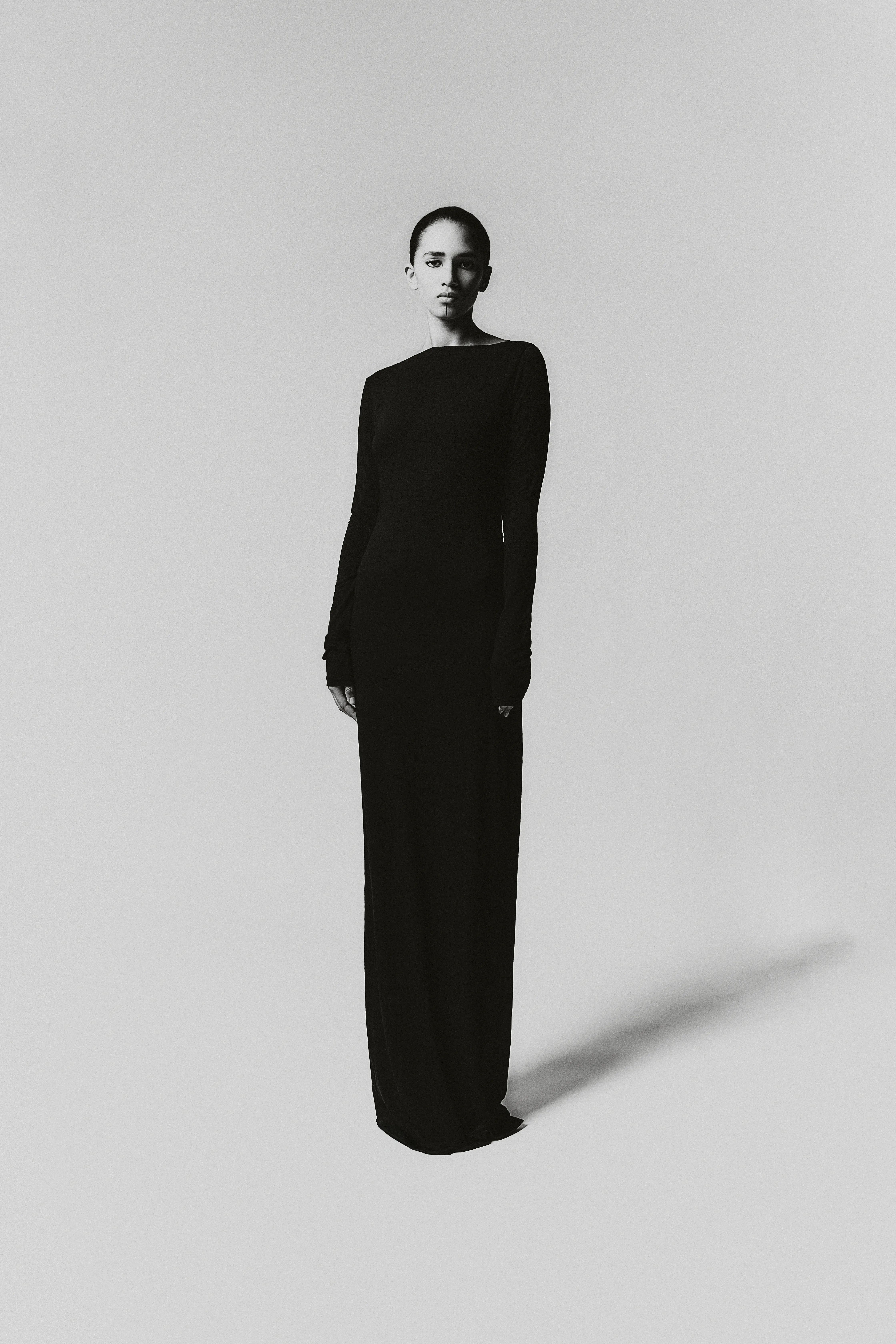 fashion editorial resilience long black figure dress